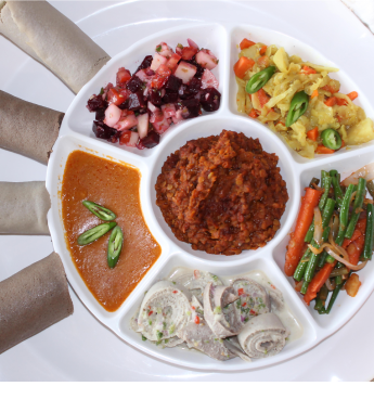 A plate of what seems like a food plater, with pudding in the middle and some vegetables around it.